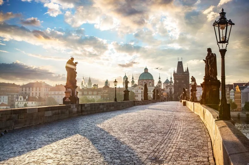 Charles Bridge in Prague, Czech Republic at sunrise with historic statues