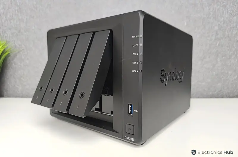 Synology DiskStation DS923+ with 4 drive bays, showing one open drive slot.