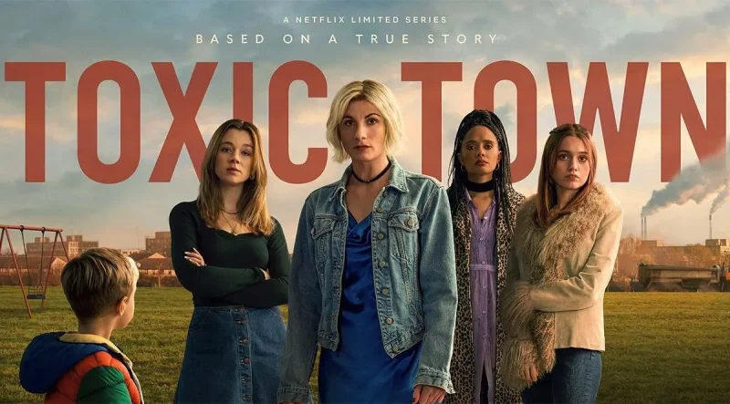 A promotional image for the Netflix series 'Toxic Town,' showcasing a group of women standing together with a child in the foreground, set against an industrial background.