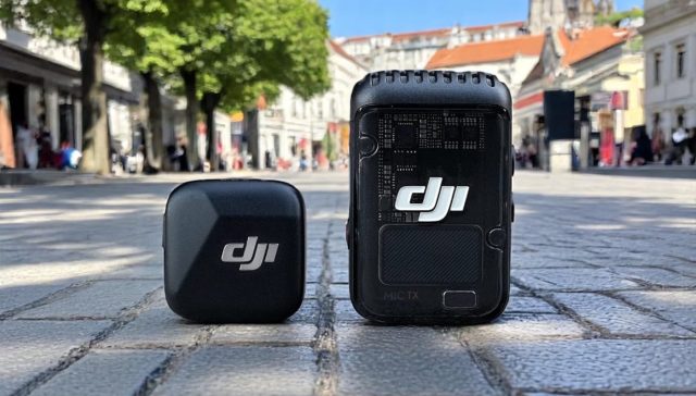 DJI Mic 2 vs Mic Mini: 6-Month Real-World Comparison Review. A DJI wireless microphone system displayed on a cobblestone street, featuring a compact transmitter and receiver.