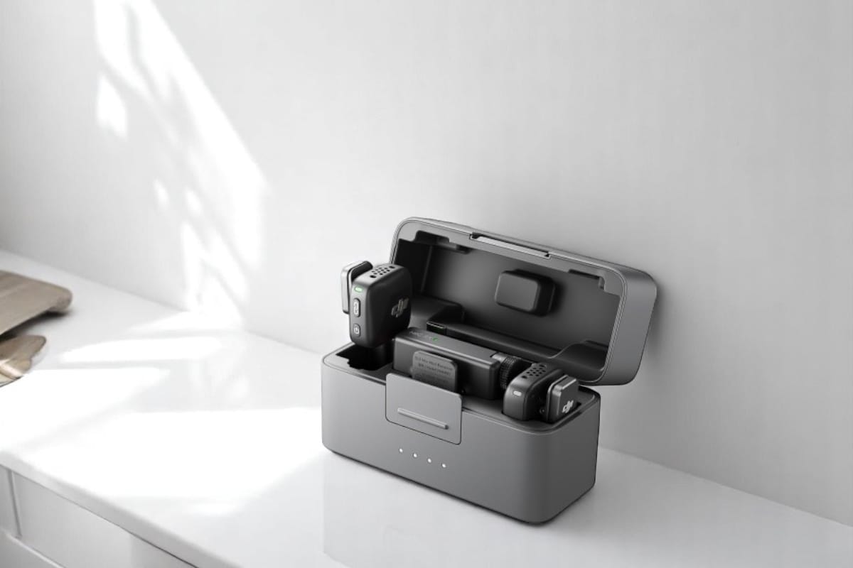 A sleek gray charging case containing DJI Mic Mini  and accessories, ideal for tech enthusiasts.