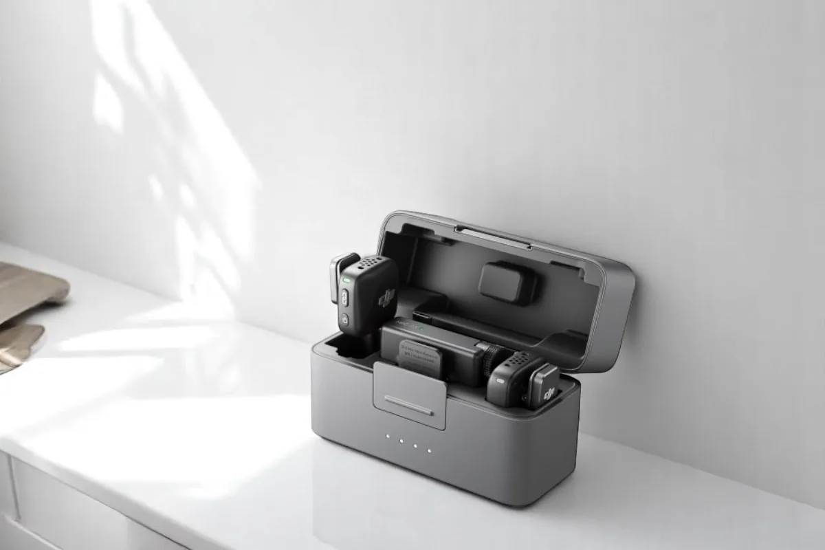 A sleek gray charging case containing DJI Mic Mini and accessories, ideal for tech enthusiasts.